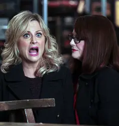 Amy Poehler On Parks and Recreation With Soft Layered Winged Hairstyle