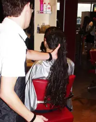 Detangling Newly Shampooed Hair - Image Courtesy Of HairBoutique.com