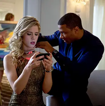 Arrow -- "Dodger" -- Image AR115a_0005b -- Pictured (L-R): Emily Bett Rickards as Felicity Smoak and David Ramsey as John Diggle -- Photo: Cate Cameron/The CW -- © 2013 The CW Network. All Rights Reserved