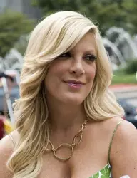 Tori Spelling With Long Side Swept Fringe