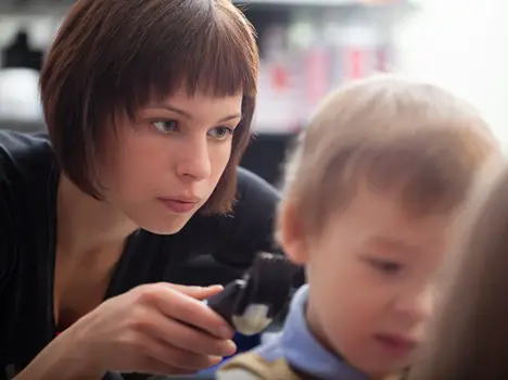 Hairstylist Cutting Young Boys Hair - HB Media - All Rights Reserved