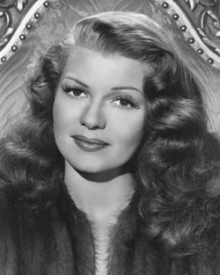 Rita Hayworth-publicity-photo. Original publicity portrait of Rita Hayworth from the film Down to Earth (1947). Columbia Pictures, photograph by Ned Scott. Public domain - Wikipedia.