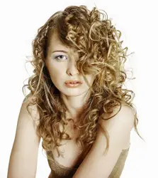 Long Naturally Curly Sandy Blonde Hair With Side Swept Long Fringe