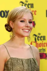 Kristen Bell Wearing Side Swept Fringe Combined With A Cinnamon Style Chignon