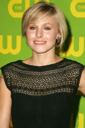 Kristen Bell Wearing Side Swept Fringe With Cinnamon Style Chignon